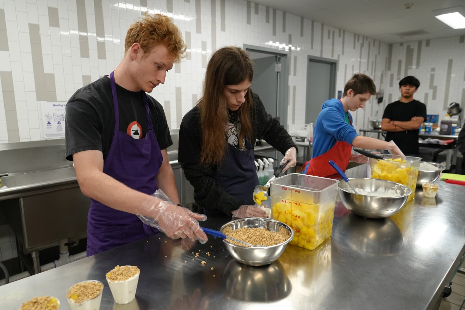 Madison Highland Prep students in a culinary club assembling parfaits